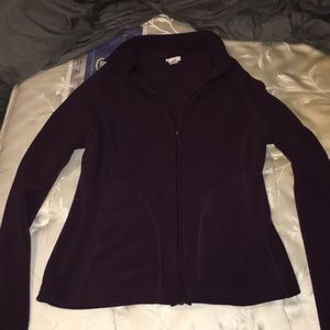 Purple zip up sweater.